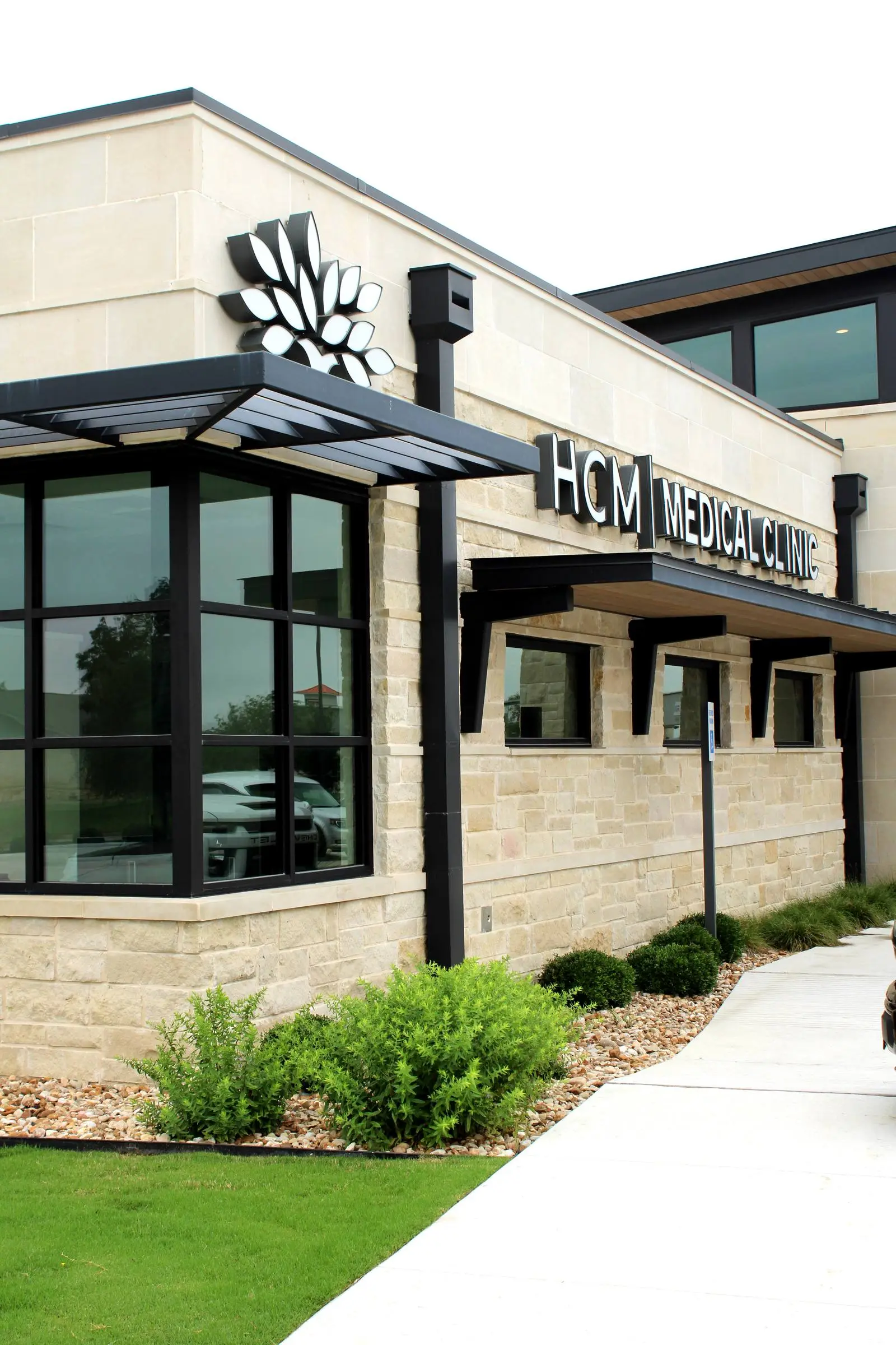 Medical-center storefront with black-framed glass in Central Texas.